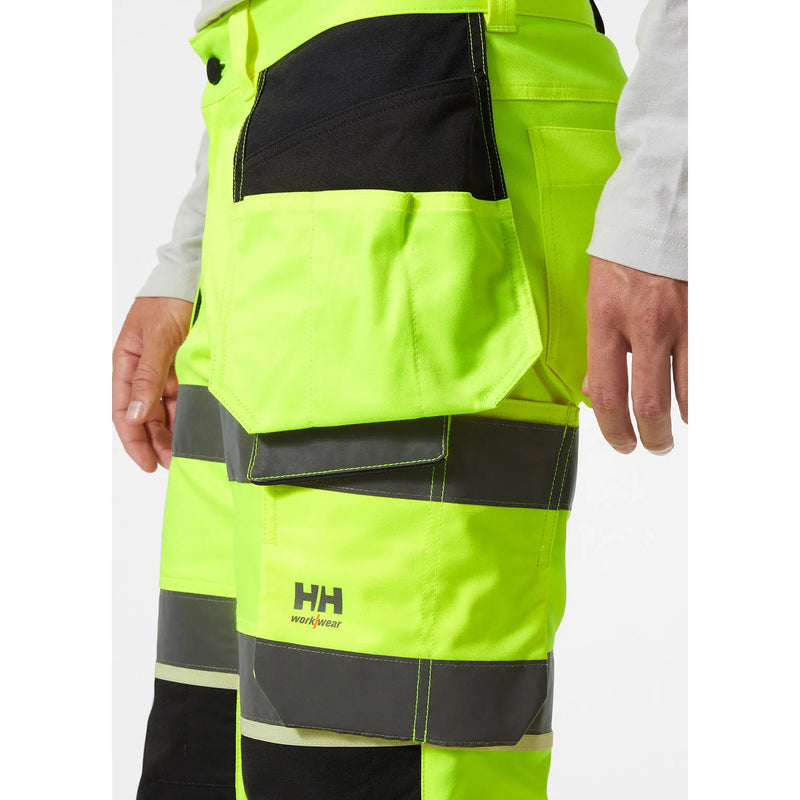 Ielādējiet attēlu galerijas skatītājā, Bikses HELLY HANSEN UC-ME Hi Vis Construction Pirate 77518
